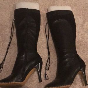 Boots with fun details. Suede trim and tassels.